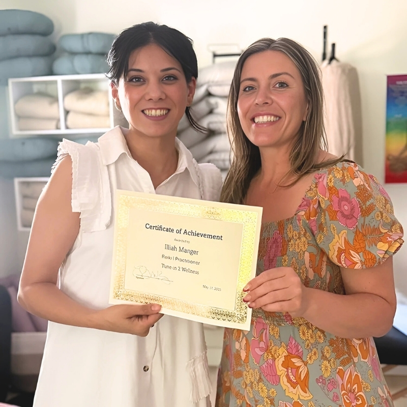 Illiah Manger and Reiki teacher Rocky Kitzmiller at Tune In2 Wellness in Virginia Beach, celebrating Illiah’s Reiki Master certification and energy alignment.